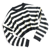A black and white striped cropped sweater laid flat on a white background, showing the front.