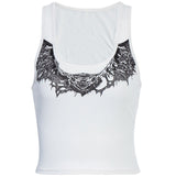 white ribbed crop top with a black graphic print of bat wings and a creature's head