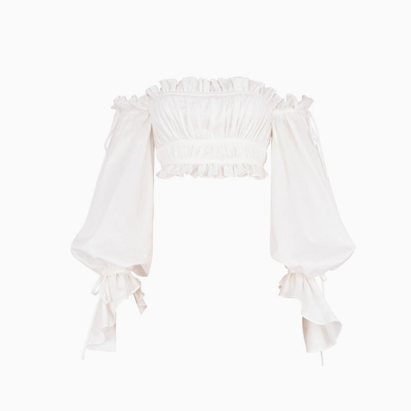 White off-the-shoulder crop top with ruffled neckline and billowy sleeves, front view, on white background