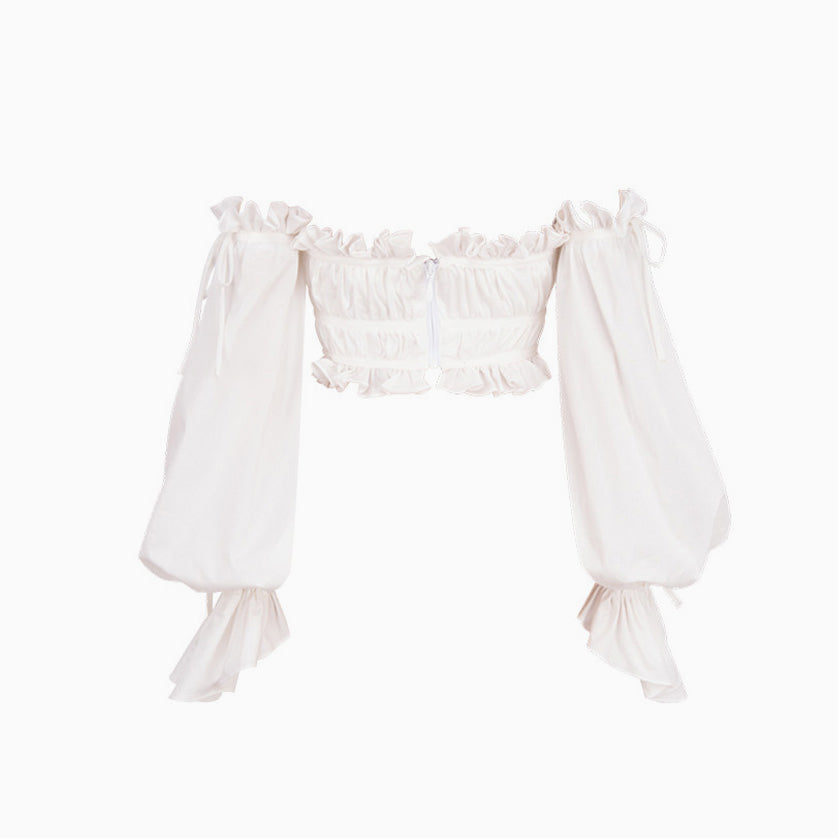 White off-the-shoulder crop top with ruffled neckline and billowy sleeves, front view, on white background