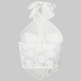 Front view of a white lace corset top with a halter neck and sheer fabric.