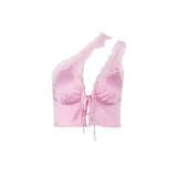 A pink one-shoulder satin crop top with lace trim and a tie-front closure.