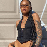 woman wearing a black halter corset top and sunglasses