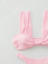 Close-up of a pink bikini top and bottom
