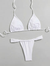 white bikini top and bottom laid out