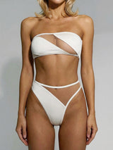 woman wearing a white strapless bikini with sheer cut-outs