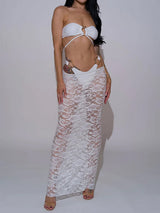 Woman wearing a white bikini with a white lace maxi skirt