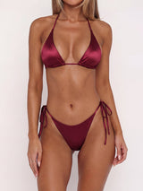 woman wearing a burgundy satin bikini