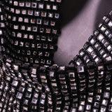 Close-up of the sequined fabric of the halter top