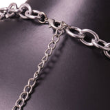 Close-up of the silver chain and clasp closure of the halter top