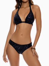 woman wearing a black sequined halter bikini