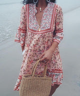 Boho floral print mini dress with bell sleeves and tassel detail - View 9 | Clistos