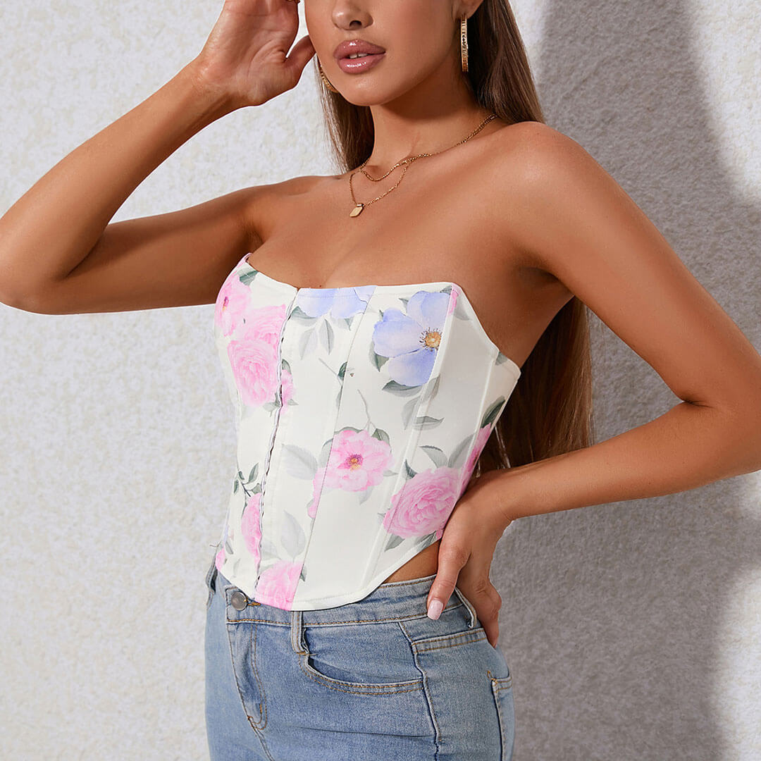 Close-up of a woman's torso showing a strapless floral corset top.