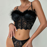 Close-up of a woman wearing a black lace corset top with fur trim.