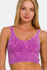 close-up of a woman wearing a pink and purple ribbed cropped tank top from the front